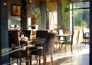 a dining room with a table and chairs at Mestia Roots in Mestia