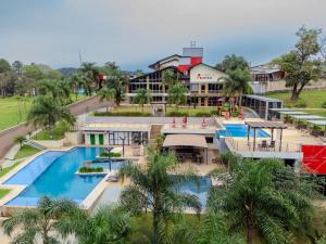 an aerial view of a resort with a swimming pool at Austral Hotel in Dos de Mayo