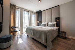 Ένα ή περισσότερα κρεβάτια σε δωμάτιο στο Residence Oude Haven luxe appartementen met sauna
