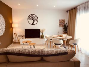 a living room with a couch and a table at villamar III in San Pedro del Pinatar