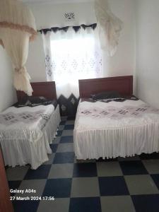 Postel nebo postele na pokoji v ubytování silver garden