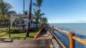 una casa sulla spiaggia vicino all'oceano di Casa na Praia de Mucugê - Arraial D'ajuda - Bahia - 40m da praia - Ar condicionado - vaga de estacionamento - Wifi a Arraial d'Ajuda