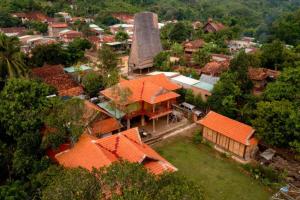 an overhead view of a village with orange roofs at Coffee Homestay A Vũ in Kon Cho Dri