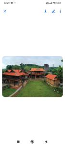 a screenshot of a website of a village with houses at Coffee Homestay A Vũ in Kon Cho Dri