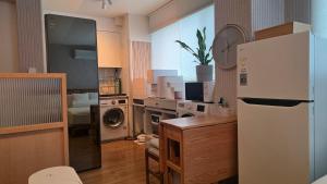 Kuchyň nebo kuchyňský kout v ubytování Ansan Minimal Studio