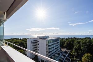 a view of the ocean from a balcony of a building at Panoramic App B08-6 in Sierksdorf