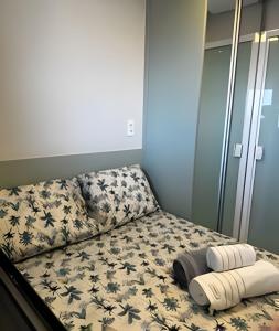 a bed with two towels on it in a room at Para quem deseja conforto e bem estar in Salvador +35 photos