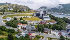 a town on a hill with a river and houses at Victoria House Signal Hill King Bbq in St. John's
