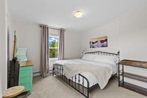 a bedroom with a bed and a window at Victoria House Signal Hill King Bbq in St. John's