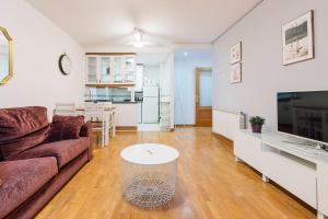 a living room with a couch and a table at Adrimarcangas 2 in Cangas de Onís