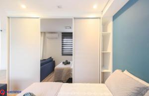 a bedroom with a bed and a room with a table at Apartamentos no Morumbi in Sao Paulo +172 photos
