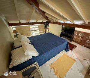 En eller flere senge i et værelse på Loft perto do centro e da praia no Engenho d'Água