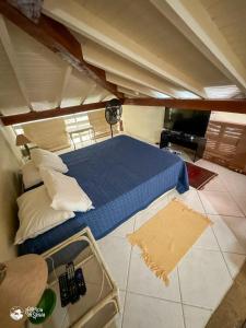 En eller flere senge i et værelse på Loft perto do centro e da praia no Engenho d'Água