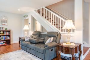 a living room with a couch and a staircase at White Fern in New Waterford