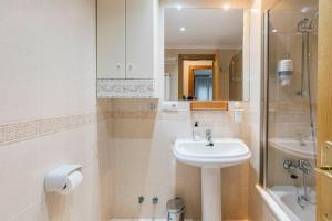 a bathroom with a sink and a shower at Adrimarcangas 2 in Cangas de Onís +22 photos