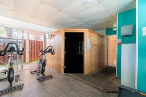 a gym with two exercise bikes in a room at Appartement - Terrasses De L'Océan in Moliets-et-Maa
