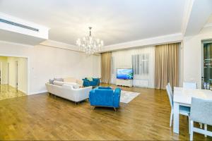 a living room with a couch and a table at Luxary Home VIP Hillton in Baku