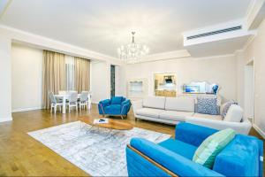 a living room with a couch and a table at Luxary Home VIP Hillton in Baku