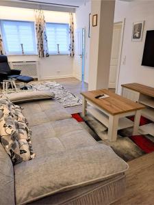 a living room with a couch and a coffee table at Ferienappartements-Grolik in Hohenwarth