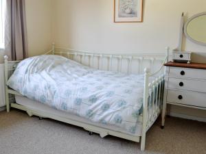 En eller flere senge i et værelse på Beach House + 4 billeder