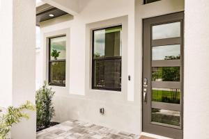 a front door of a house with windows at Luxury Naples 4br W Pool Near Vanderbilt Beach in Naples +45 photos