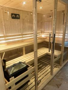 a sauna with a sink in the middle at Garden secret in Strasbourg