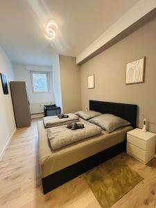 Ένα ή περισσότερα κρεβάτια σε δωμάτιο στο RheinZeit Apartment Köln Bonn