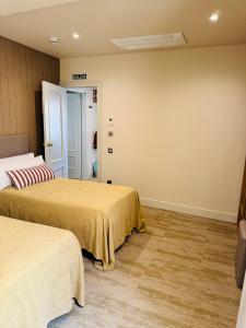 Ένα ή περισσότερα κρεβάτια σε δωμάτιο στο Hotel Vélez +57 φωτογραφίες