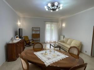 a living room with a table and a couch at La Fonte Segreta in Montelanico