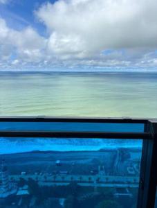 a view of the ocean from the window of an airplane at ORBI CITY NEW APARTMENTS Official BATUMI in Batumi