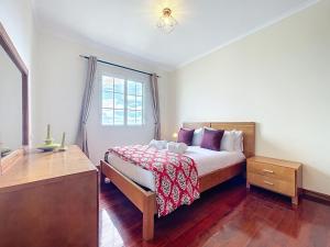 a bedroom with a bed and a window at Gaula Family Haven by Atlantic Holiday in Gaula