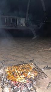 a cage of food sitting on the ground next to a plane at Felucca, welcome sailing in Aswan