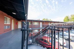 a staircase in a building with cars in a parking lot at Banfield Studios By OYO Portland OR in Portland