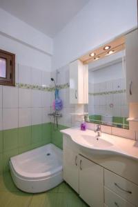 Koupelna v ubytování Taho Apartments + 83 fotografií