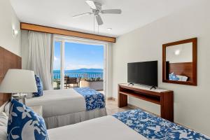 TV a/nebo společenská místnost v ubytování Grand Miramar A402