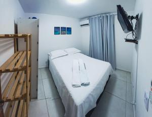 Ένα ή περισσότερα κρεβάτια σε δωμάτιο στο Lindo Apartamento em João pessoa com ar condicionado