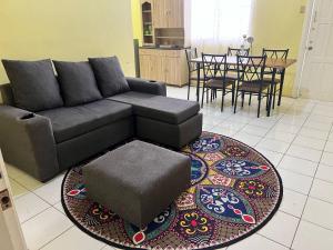 a living room with a couch and a table at Emerald Aparments INC in Kitty