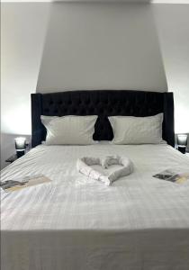 Postel nebo postele na pokoji v ubytování Grey Apartament