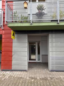 a building with a door and a balcony at YCZ Praha in Prague