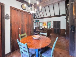 a dining room with a wooden table and chairs at JME Retreat in Colwell