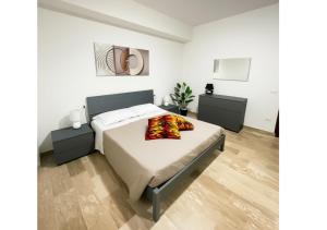 a bedroom with a bed and two night stands at Chic house in Avezzano +9 photos