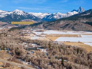 an aerial view of a resort with snow covered mountains at Basecamp Stays: Upscale Getaway Shuttle Hot Tubs in Alta