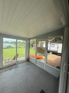 a garage with windows and a view of a rv at Lake Front Entire Home FL Getaway in Deltona