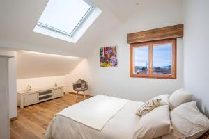 Ένα ή περισσότερα κρεβάτια σε δωμάτιο στο Les Clés de l'Excellence