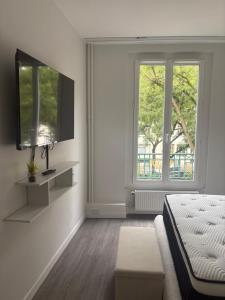 Katil atau katil-katil dalam bilik di Hôtel Sofiane