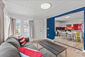 a living room with a couch and a table at Pet Friendly Condo across from the beach in Myrtle Beach
