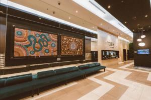 a lobby with a large screen in a store at Brisbane Central CBD convivence! in Brisbane