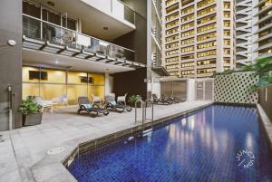 a large swimming pool in the middle of a building at Brisbane Central CBD convivence! in Brisbane