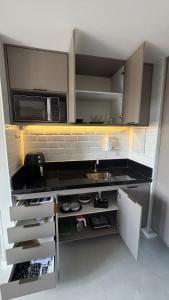 Η κουζίνα ή μικρή κουζίνα στο Studio a 600m do Park Sul e Unimed +29 φωτογραφίες