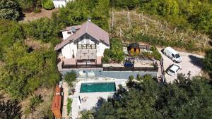 an overhead view of a house with a swimming pool at Beloviski raj 